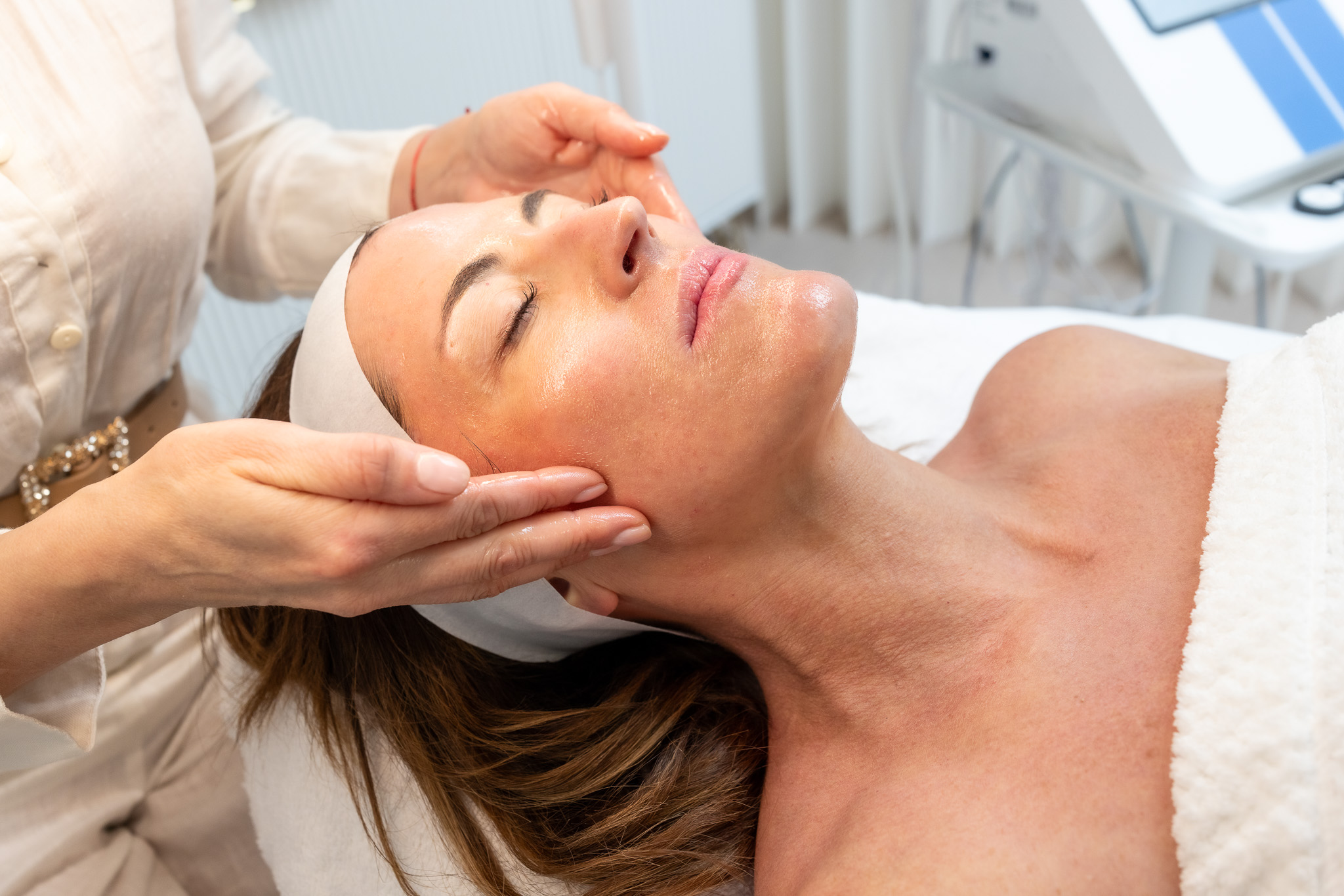 Woman receiving relaxing facial treatment.(Facial Treatments Key West)
